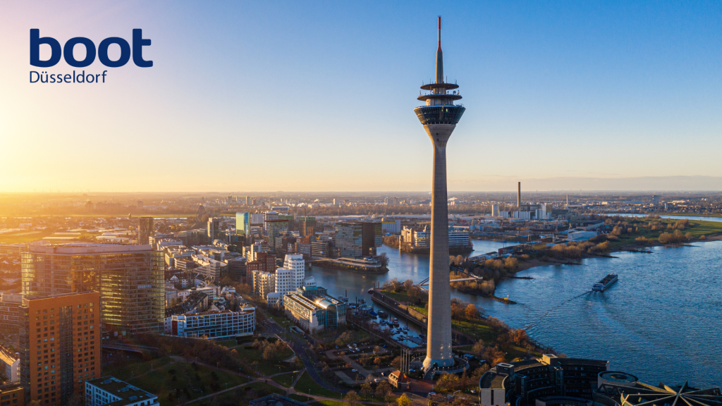 Image shows landscape of Dusseldorf in Germany from its tall buildings to the city below.